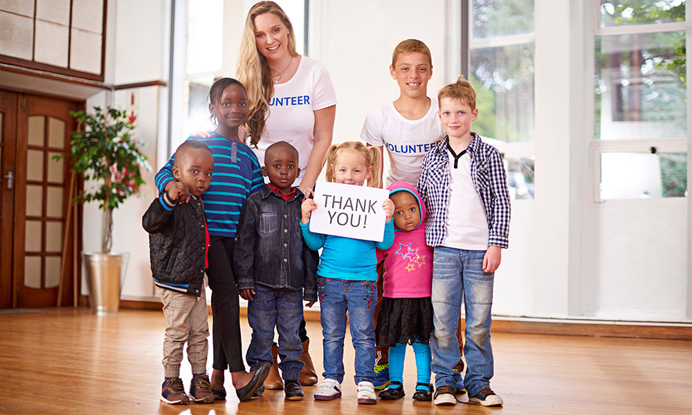 Volunteers with Children in a Foster Home