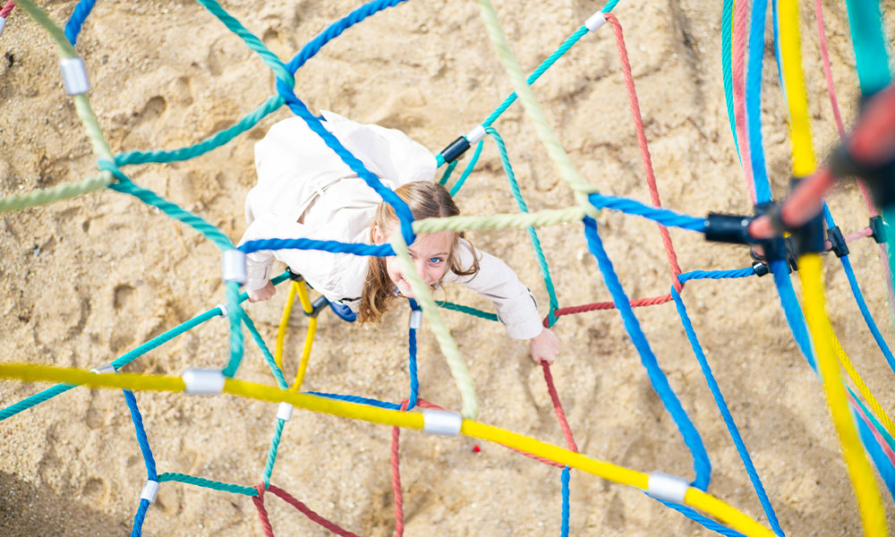 Little Girl Playing in Playground