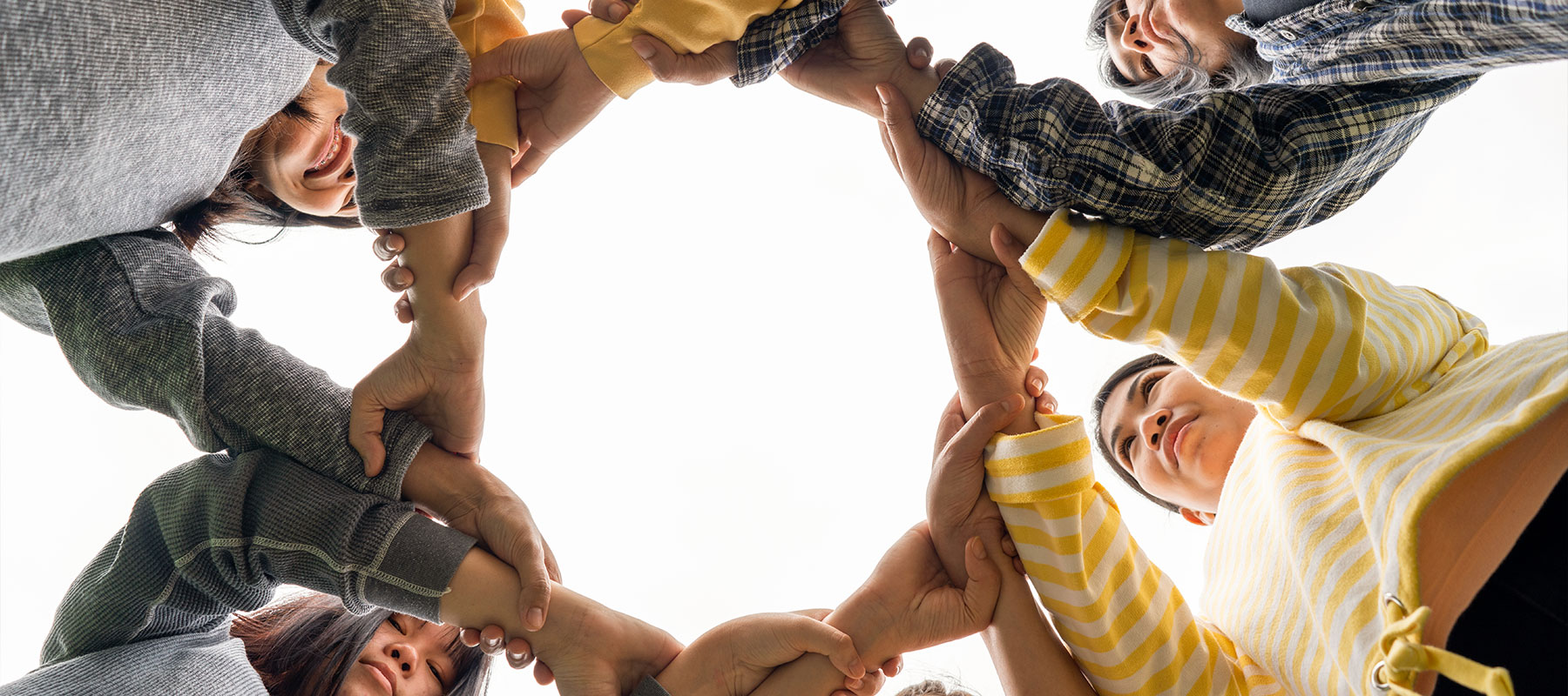 Volunteers with Arms Together